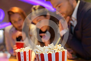 portrait people and popcorn in cinema photo