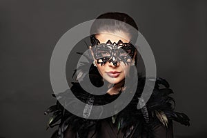 Portrait of perfect woman in carnival mask. Holiday fashion model portrait. Beauty hairstyle and makeup.