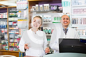 Portrait of pharmacists working in farmacy photo