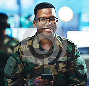 Portrait, phone and a military black man in a control room for surveillance, communication or networking. Face, smile