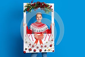 Portrait photo cadre of young celebrating new year girl wish magic xmas midnight hold paper frame adorment isolated on