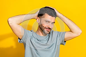 Portrait photo of young positive successful confident rich bearded man touching his clean combining hair good mood look
