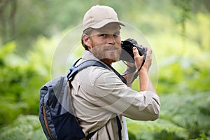 portrait photographer taking pictures in natural landscape
