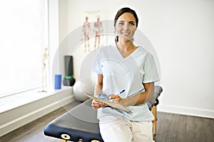 Portrait of a physiotherapy woman smiling in uniforme photo
