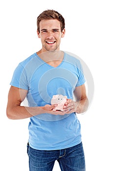 Portrait, piggy bank and happy man in studio for budget, finance or investment. Face, smile and person with money box photo