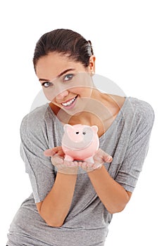 Portrait, piggy bank and happy woman in studio for budget, finance or investment. Face, smile and person with money box photo