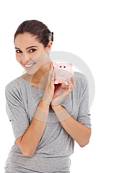 Portrait, piggy bank and happy woman in studio for finance, budget or investment. Face, smile and person with money box photo