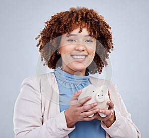 Portrait, piggy bank and happy woman in studio for savings, growth and budget on white background. Money, box and face photo