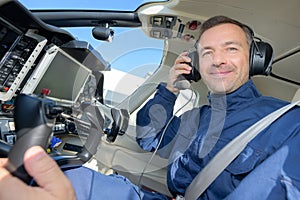 Portrait pilot in aircraft