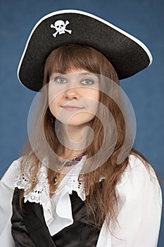 Portrait of pirate girl in black hat