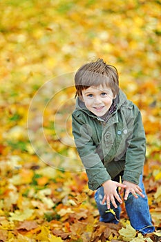 Portrait of playful little boy in the park