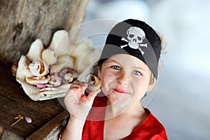 Portrait of playful pirate boy photo