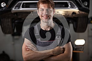 Portrait of pleasant auto mechanic posing