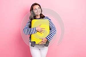 Portrait of pleasant gorgeous girl curly hairstyle wear striped clothes hugging luggage look empty space isolated on