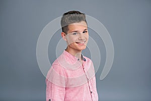 Portrait of a pleasant smiling teenage boy