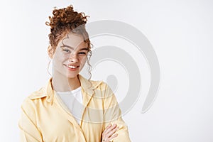 Portrait pleasant tender happy giggling nice girl redhead freckles curly messy bun cross arms chest confident friendly