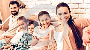 Portrait of Pleased Family After Cleaning Home.