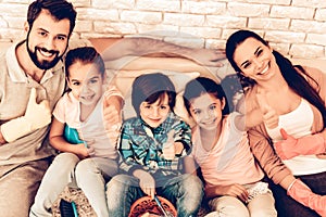 Portrait of Pleased Family After Cleaning Home.