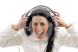 Portrait of pleased woman holding headphone