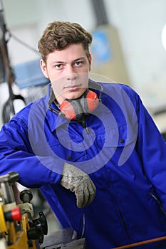 Portrait of plumber apprentice in workshop