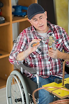 portrait plumber in wheelchair