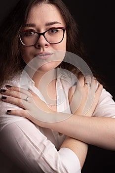 Portrait of a plump brunette with long curly hair