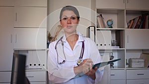 Portrait of polite female health worker meeting patient in medical office