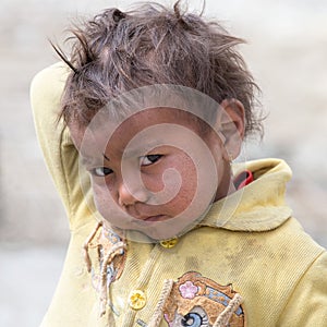 Portrait poor young boy in India