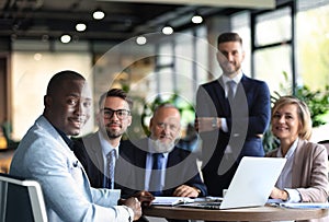 Portrait of a positive business employees at an office business meeting