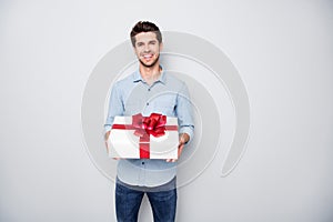 Portrait of positive charming lover man hold gift box present for 14-february 8-march feel content enjoy holiday wear