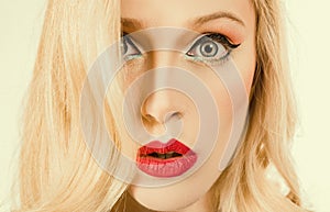 Portrait of positive cheerful amazed girl. Retro pin up make up - close up. Fashion. Beautiful blonde woman with retro