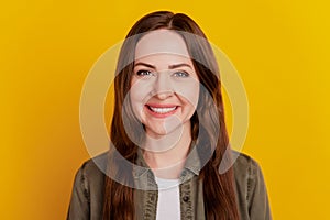 Portrait of positive cheerful charming girl toothy smile on yellow background