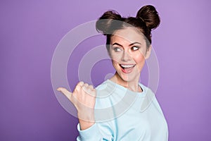 Portrait of positive cheerful energetic girl millennial point thumb finger copyspace indicate advert promotion recommend