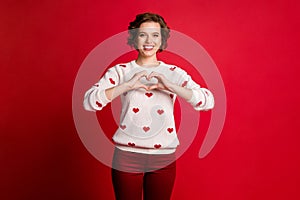 Portrait of positive cheerful girlfriend celebrate 14-february date show chest hands heart passionate lover sign wear