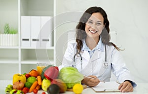 Portrait of positive lady dietitian looking at camera and smiling