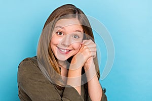 Portrait of positive little woman with long blonde hair cozy comfort appreciation isolated on blue color background