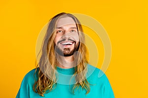 Portrait of positive minded person toothy smile look up empty space inspiration isolated on yellow color background