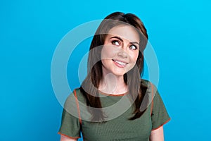 Portrait of positive pretty girl toothy smile look empty space fantasize isolated on blue color background