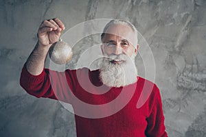 Portrait of positive stylish old man enjoy christmas party celebration preparation hold golden x-mas tree toy wear
