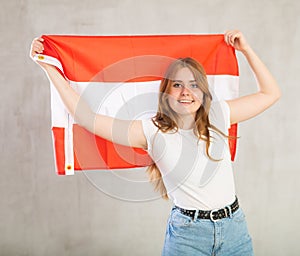Portrait of positive young girl with flag of Austria