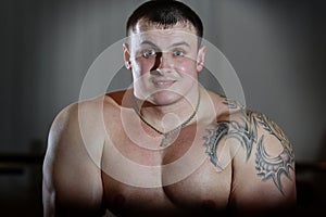 Portrait of powerlifter with tattoo