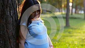 Portrait of pregnant 9 month woman dreaming