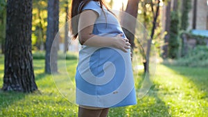 Portrait of pregnant 9 month woman smiling pan