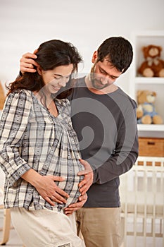 Portrait of pregnant couple expecting baby