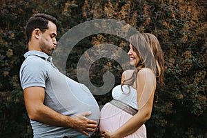Portrait of pregnant wife and pregnant husband