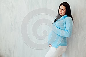 Portrait of a pregnant woman preparing to come baby