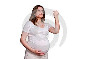 Portrait of a pregnant woman with a threatening fist gesture on a white
