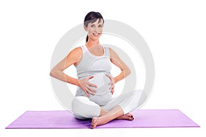 Portrait, pregnant and yoga with woman on exercise mat in studio isolated on white background. Fitness, pilates and