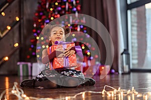 Portrait of a preschool child girl laying down. Studio shot