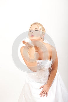Portrait of pretty bride in white wedding gown